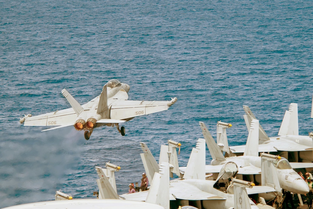 An EA-18G Growler from VAQ-137 launches from USS Theodore Roosevelt (CVN 71) in the South China Sea.