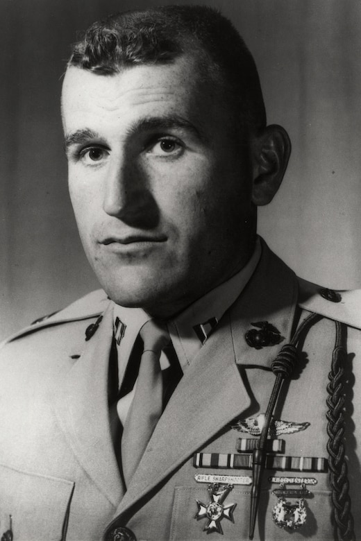 A person in uniform poses for a photo.