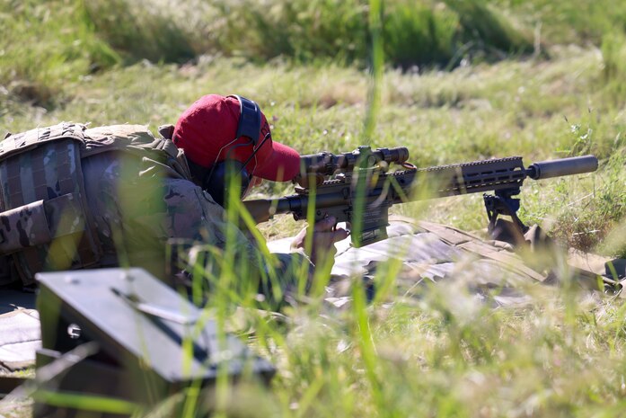 U.S. Air Force Staff Sgt. Michael Ionin, 9th Security Forces Squadron NCO in charge of combat arms, lines up a shot with the M110A1 rifle at Beale Air Force Base, California, April 11, 2024.