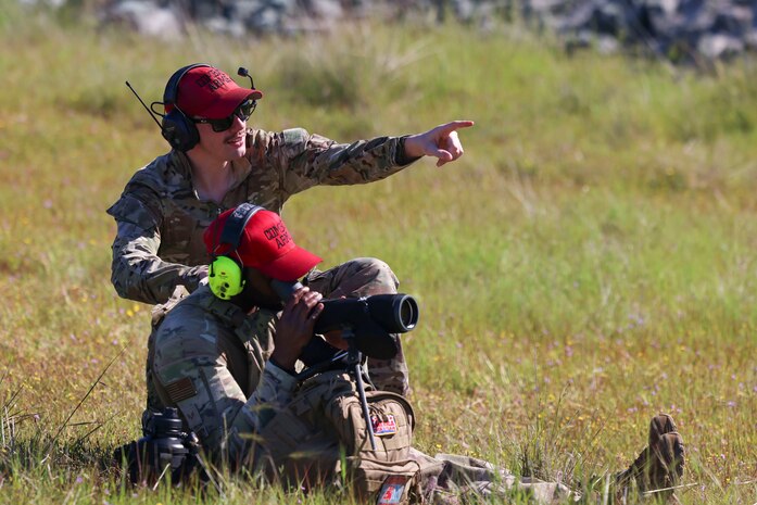 U.S. Air Force Senior Airman James Garrard, 9th Security Forces Squadron combat arms instructor, teaches U.S. Air Force Senior Airman Johnathan Gibbs, 9th SFS combat arms instructor, how to watch long range targets at Beale Air Force Base, California, April 11, 2024.