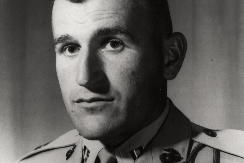 A person in uniform poses for a photo.
