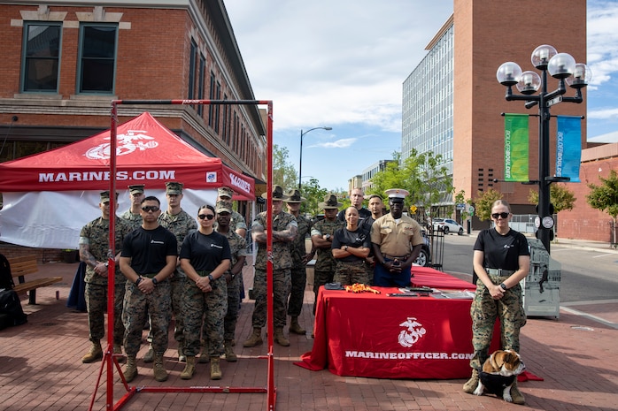 U.S. Marines from the Western Recruiting Region pose for a photo at the Marines booth during the BOLDERBoulder 10-kilometer race weekend, at Boulder Colorado, May 26, 2024. MCRDSD and Western Recruiting Region are sending Marines to represent the depot during the 2024 BOLDERBoulder 10k race to engage with the local community and showcase the spirit of our organization. (U.S. Marine Corps photo by Sgt. Yvonna Guyette)