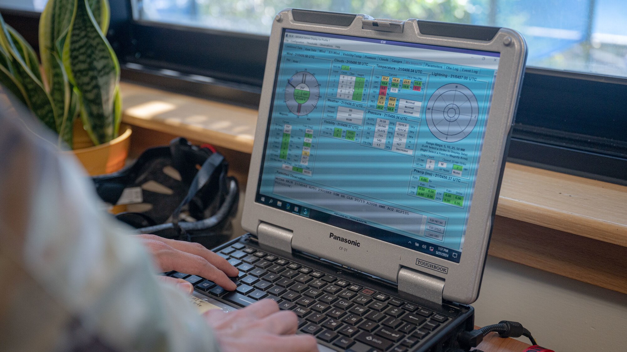 1st Lt. Evan Cade, 8th Operations Support Squadron weather flight commander, looks at historical weather data on a tactical weather sensor.