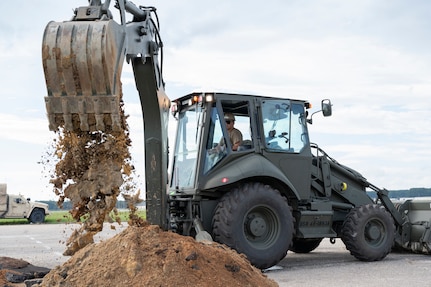 A Seabee operates a bull dozer during a military exercise