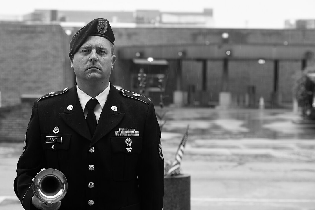 U.S. Army Reserve Staff Sgt. Kyle Rinke, 484th Army Band, stands with his bugle after playing Taps at the Village of Norridge Memorial Day ceremony, May 26, 2024.