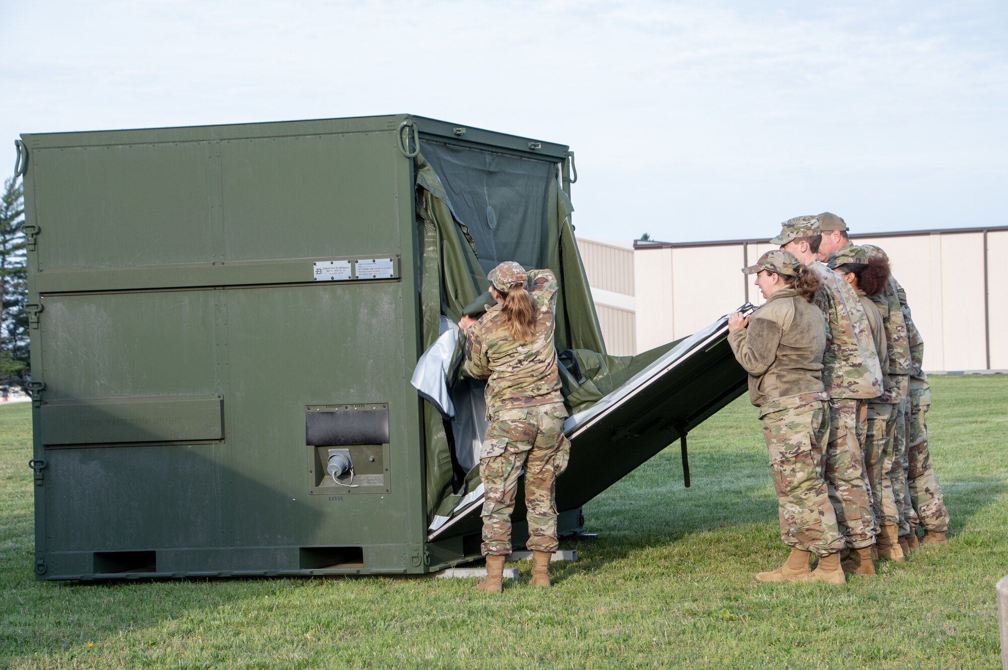 Air National Guard Airman unpack the ESPEK kitchen.