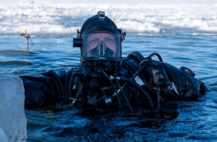 diver dives in cold water