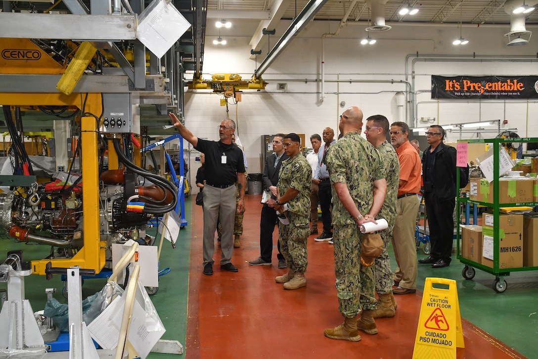 An employee explains the capabilities of the APU Test Facility.