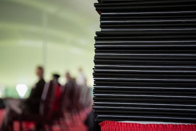 Stack of NDU diplomas waiting to be conferred upon students.