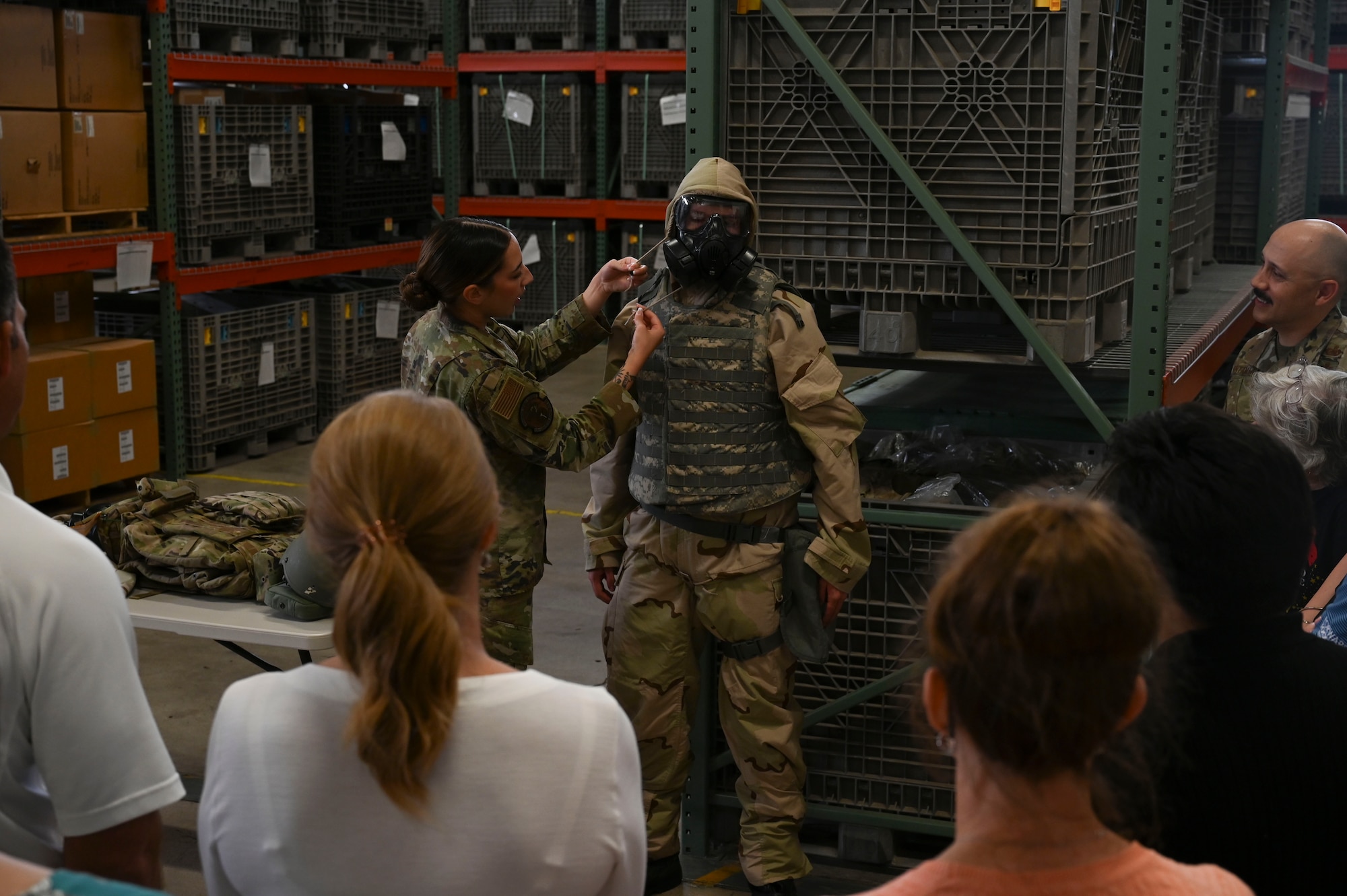Service members assigned to the 17th Logistics Readiness Squadron demonstrate MOPP, Mission Oriented Protective Posture, Gear procedures at the Vance Deployment Center during the 17th Mission Support Group immersion at Goodfellow Air Force Base, Texas, May 23, 2024. Expeditionary Readiness Training, designed by the 17th LRS, is designed to create Mission Ready Airmen with competencies that increase their lethality, survivability and enable deployers to support Agile Combat Employment operations in a deployed environment. (U.S. Air Force photo by Airman 1st Class Madison Collier)