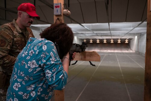 Janis Baucom, 17th Training Wing honorary commander, aims a weapon during a Combat Arms Training and Maintenance course at Goodfellow Air Force Base, Texas, May 23, 2024. The immersion concluded with a visit to the 17th Security Forces Squadron, where the honorary commanders learned about the squadron's efforts to keep Goodfellow secure, including base safety, weapons training, and agile operations worldwide. (U.S. Air Force photo by Senior Airman Sarah Williams)