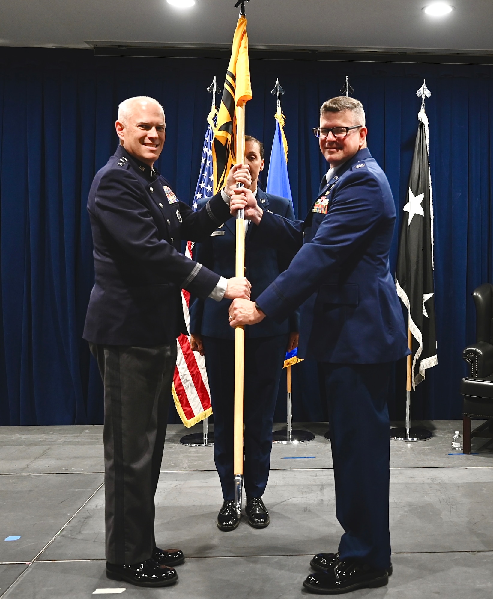 In a symbolic gesture, Garrant passed the command flag to Dermansoki, the new delta commander, pausing for a quick photo.