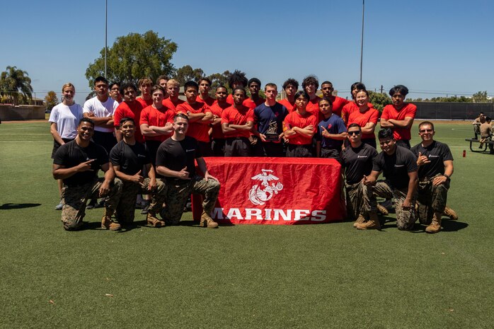 U.S. Marines and poolees with Recruiting Sub-Station Poway, Recruiting Station San Diego, pose for a photograph during the RS San Diego annual pool function on Marine Corps Air Station Miramar, Calif., May 18, 2024. The annual pool function is an opportunity for poolees to build camaraderie, strengthen their commitment to the Marine Corps, and prepare for recruit training by competing in athletic competitions and receiving military related periods of instruction. (U.S. Marine Corps photo by Sgt. Jesula Jeanlouis)