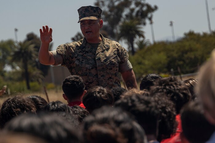 U.S. Marine Corps Sgt. Maj. Luis Ortega, sergeant major of Recruiting Station San Diego, speaks to poolees during the RS San Diego annual pool function on Marine Corps Air Station Miramar, Calif., May 18, 2024. The annual pool function is an opportunity for poolees to build camaraderie, strengthen their commitment to the Marine Corps, and prepare for recruit training by competing in athletic competitions and receiving military related periods of instruction. (U.S. Marine Corps photo by Sgt. Jesula Jeanlouis)