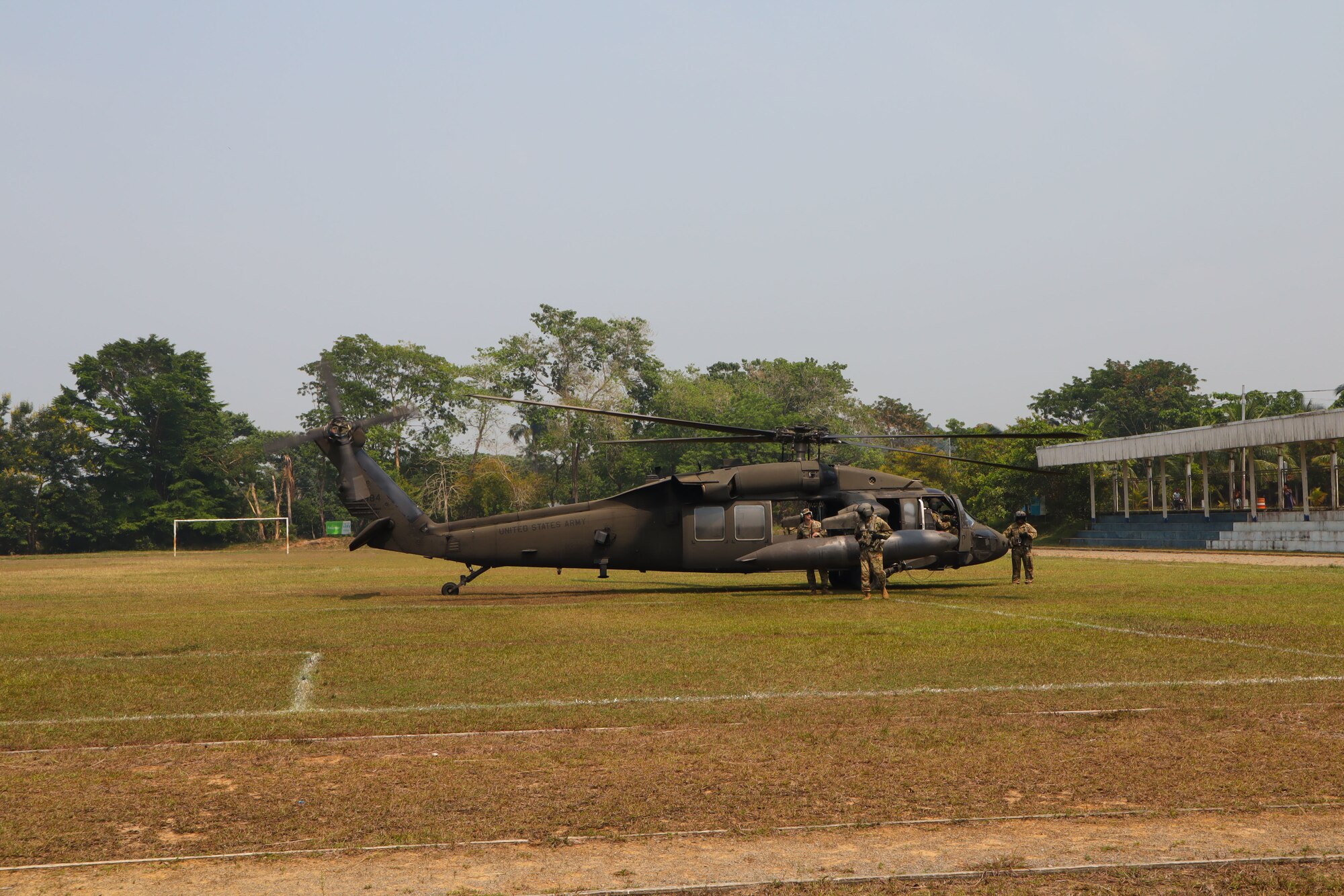 A photo of a helicopter on a soccer field.