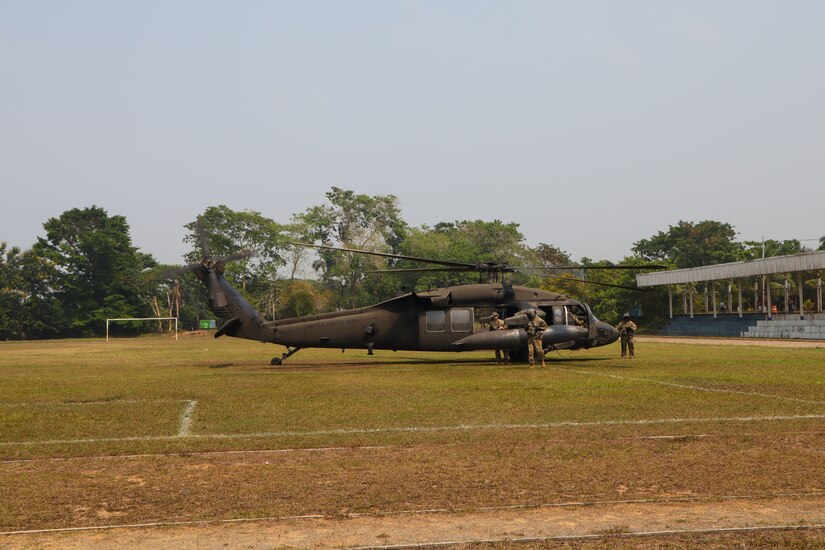 A photo of a helicopter on a soccer field.