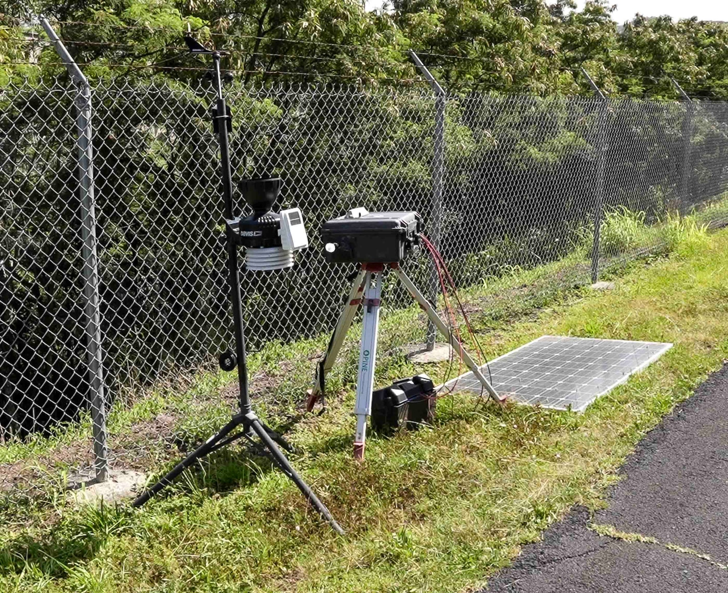 HALAWA, Hawaii (May 28, 2024) An air quality monitoring (AQM) station set up before the start of fuel tank ventilation at the Red Hill Bulk Fuel Storage Facility (RHBFSF) in Halawa, Hawaii, May 28, 2024. As part of venting operations, the task force has installed nine AQM stations at the RHBFSF perimeter to track changes in air quality, measure potential volatile organic compound (VOC) levels, and collect atmospheric data (i.e., air speed, wind direction, temperature, humidity, barometric pressure).  The tank ventilation and air monitoring procedures have undergone regulatory scrutiny to ensure the safety of the surrounding community while allowing workers to safely enter and clean the interior of the tanks. Charged with the safe decommissioning of the Red Hill Bulk Fuel Storage Facility, Navy Closure Task Force-Red Hill was established by the Department of the Navy as a commitment to the community and the environment. (U.S. Navy photo by Mass Communication Specialist 1st Class Glenn Slaughter)
