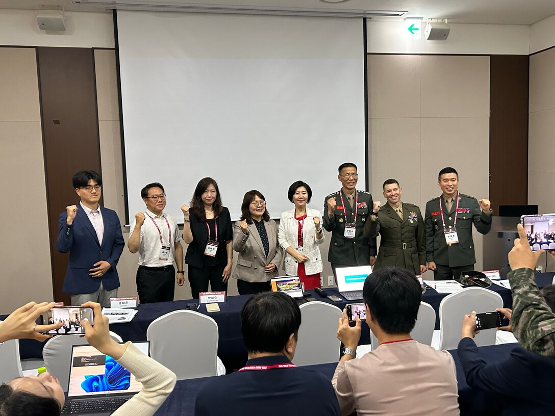 U.S. Marines and Republic of Korea Marines pose for a photo during a Science and technology Day conference in Seoul, Republic of Korea, May 14, 2024. The purpose of the conference was to discuss new and emerging technologies and scientific advancements with international partners and industry experts.