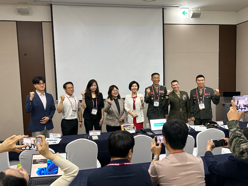 U.S. Marines and Republic of Korea Marines pose for a photo during a Science and technology Day conference in Seoul, Republic of Korea, May 14, 2024. The purpose of the conference was to discuss new and emerging technologies and scientific advancements with international partners and industry experts.