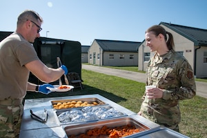 Air National Guard Airman serves Airman in OCP uniform outside of the ESPEK.