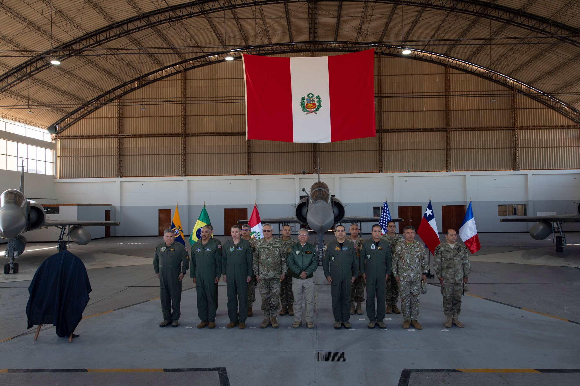 Senior defense officials from the U.S. and Peruvian militaries prepare to deliver remarks at the Resolute Sentinel 2024 opening ceremony in Grupo 4 in La Joya, Peru, May 27, 2024.