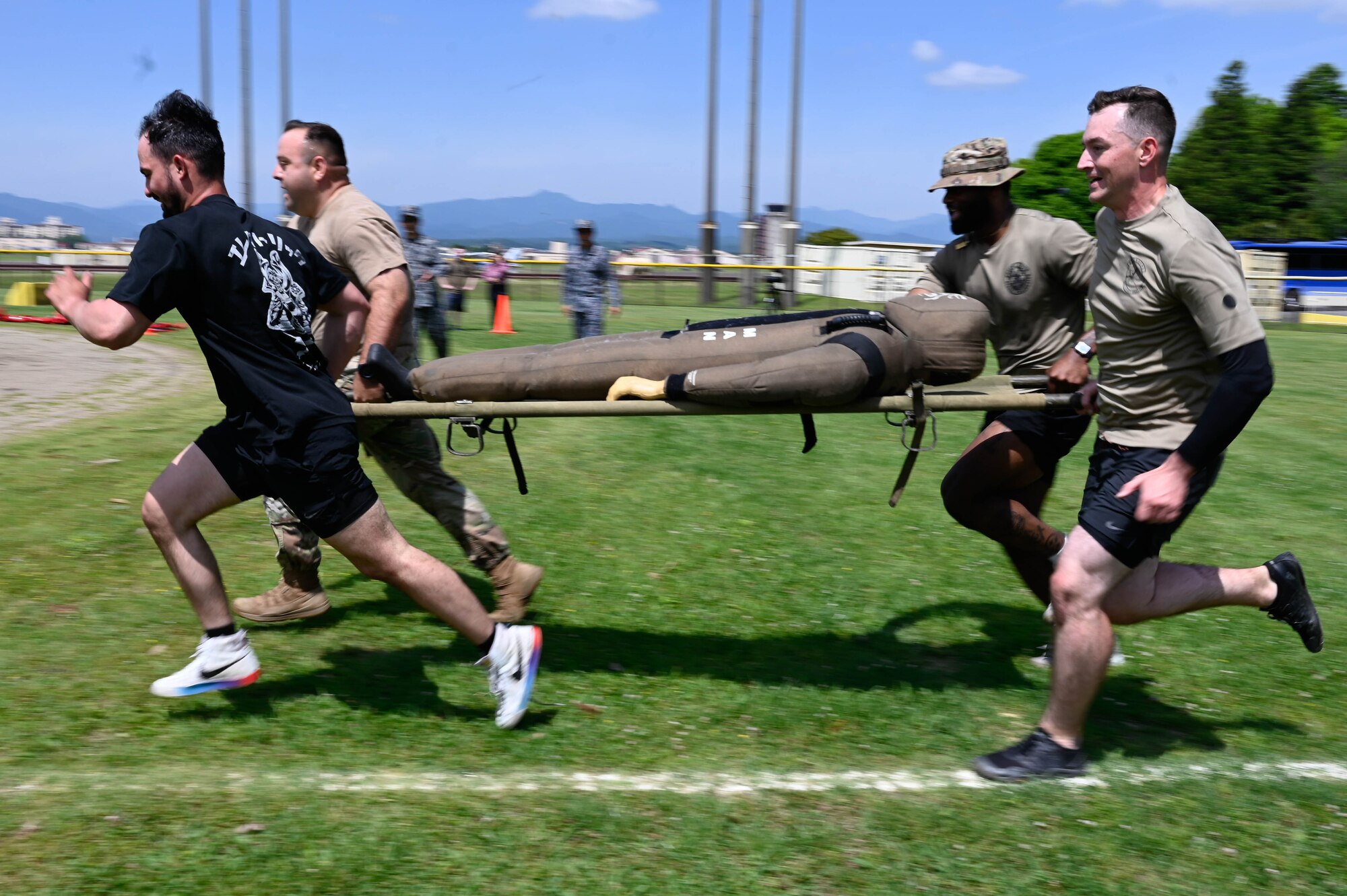A group of people run to the goal.