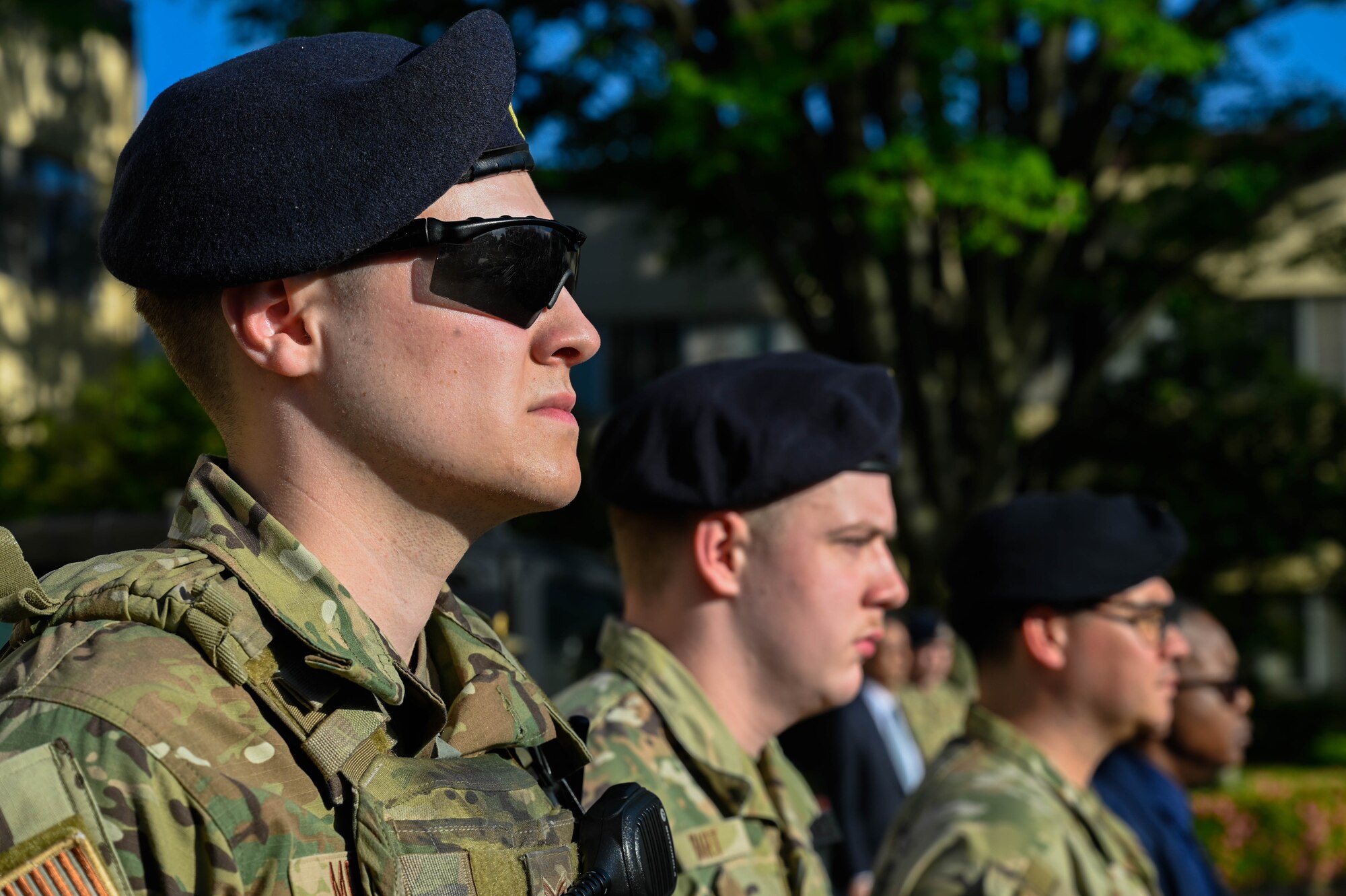 Law enforcement stand at attention.