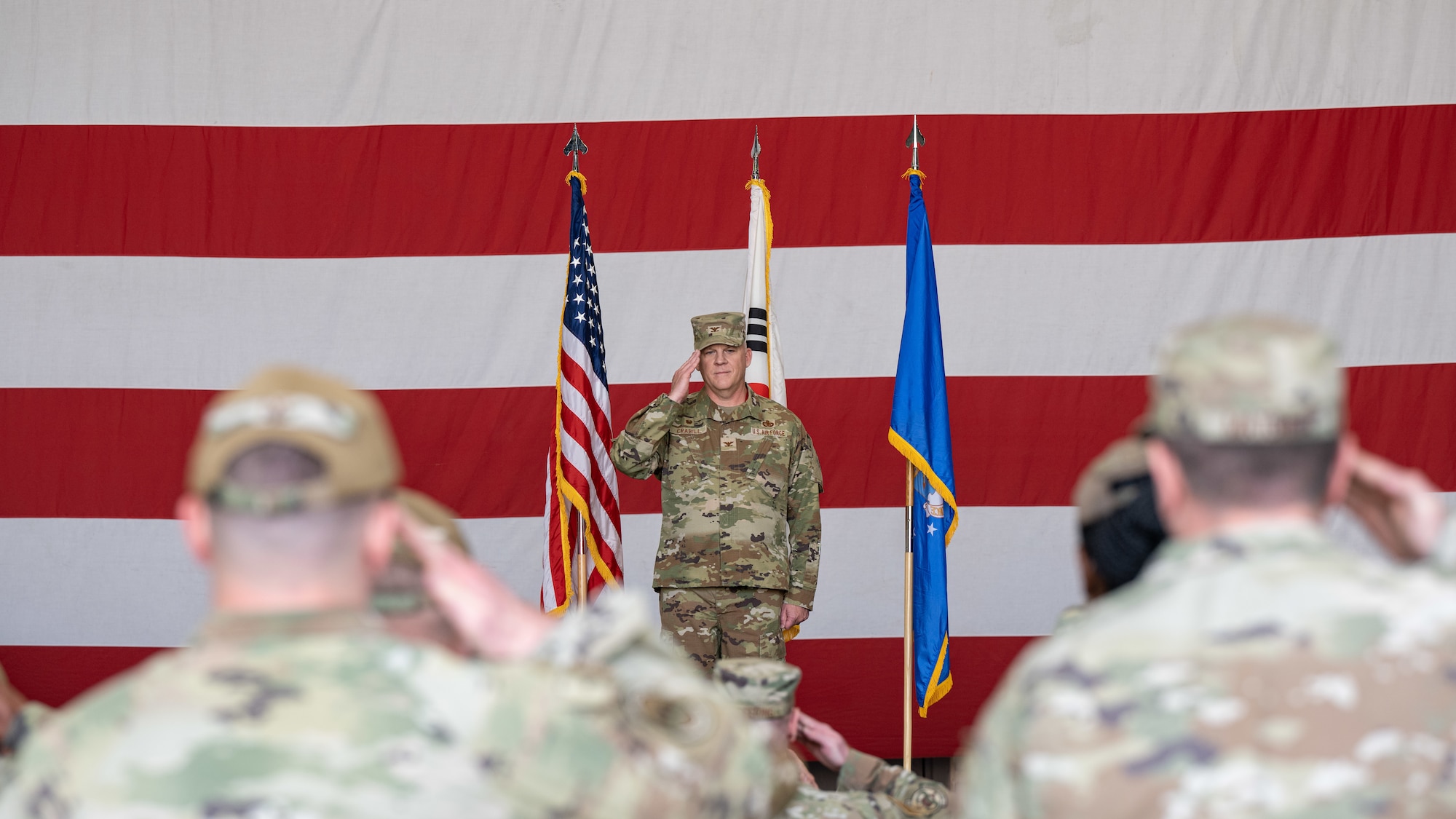 Col. Casey Crabill, 8th Maintenance Group incoming commander, renders his first salute to the Airmen of the 8th MXG during the 8th MXG change of command ceremony at Kunsan Air Base, Republic of Korea.