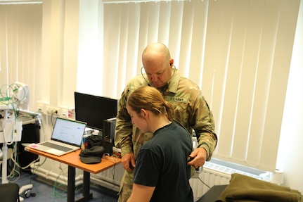 U.S. Army Sgt. 1st Class Ben Barnes, assigned to the 134th Medical Company Ground Ambulance, 109th Multifunctional Medical Battalion, assesses an injured Soldier at the Joint Multinational Readiness Center near Hohenfels, Germany, May 29, 2024, during Exercise Combined Resolve 24-2.