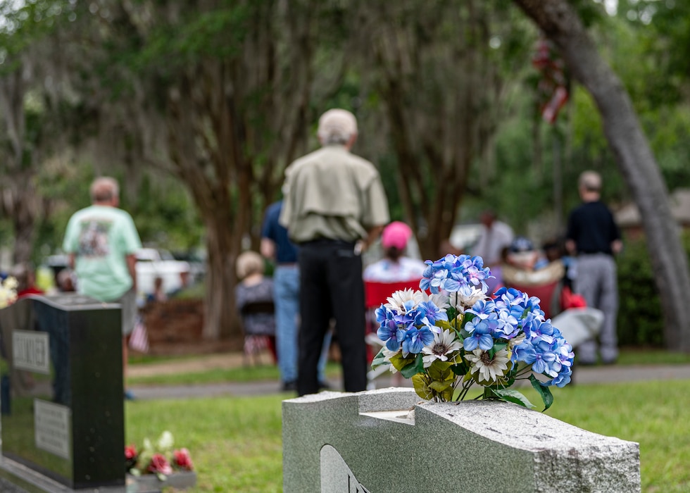 Flowers rest on a gravestone at Sunset Hill Cemetery during a Memorial Day service in Valdosta, Georgia, May 27, 2024. Memorial Day is a federal holiday in the United States for honoring and mourning the U.S. military personnel who died while serving our nation. (U.S. Air Force photo by Airman 1st Class Leonid Soubbotine)