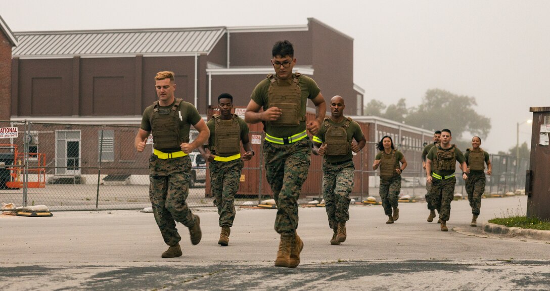 U.S. Marines with Communication Strategy and Operations, 2nd Marine Aircraft Wing and Marine Corps Air Station Cherry Point, run at Marine Corps Air Station Cherry Point, North Carolina, May 21, 2024. The workout is dedicated to honoring the memories of U.S. Marine Corps Cpl. Sara A. Medina, a combat photographer, and Lance Cpl. Jacob Hug, a combat videographer, both assigned to Marine Corps Installations Pacific. Both Medina and Hug were on board a UH-1Y Venom helicopter with Marine Light Attack Helicopter Squadron (HMLA) 469 that crashed during a humanitarian mission after a 7.8 magnitude earthquake hit Nepal in 2015. (U.S. Marine Corps photo by Lance Cpl. Madison Blackstock)