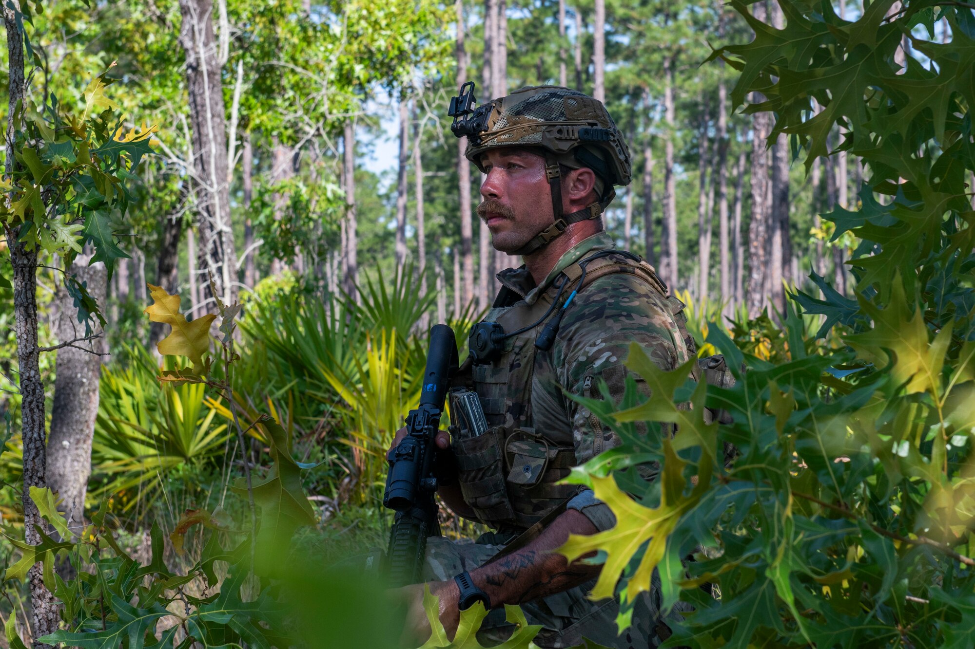 Airman kneels