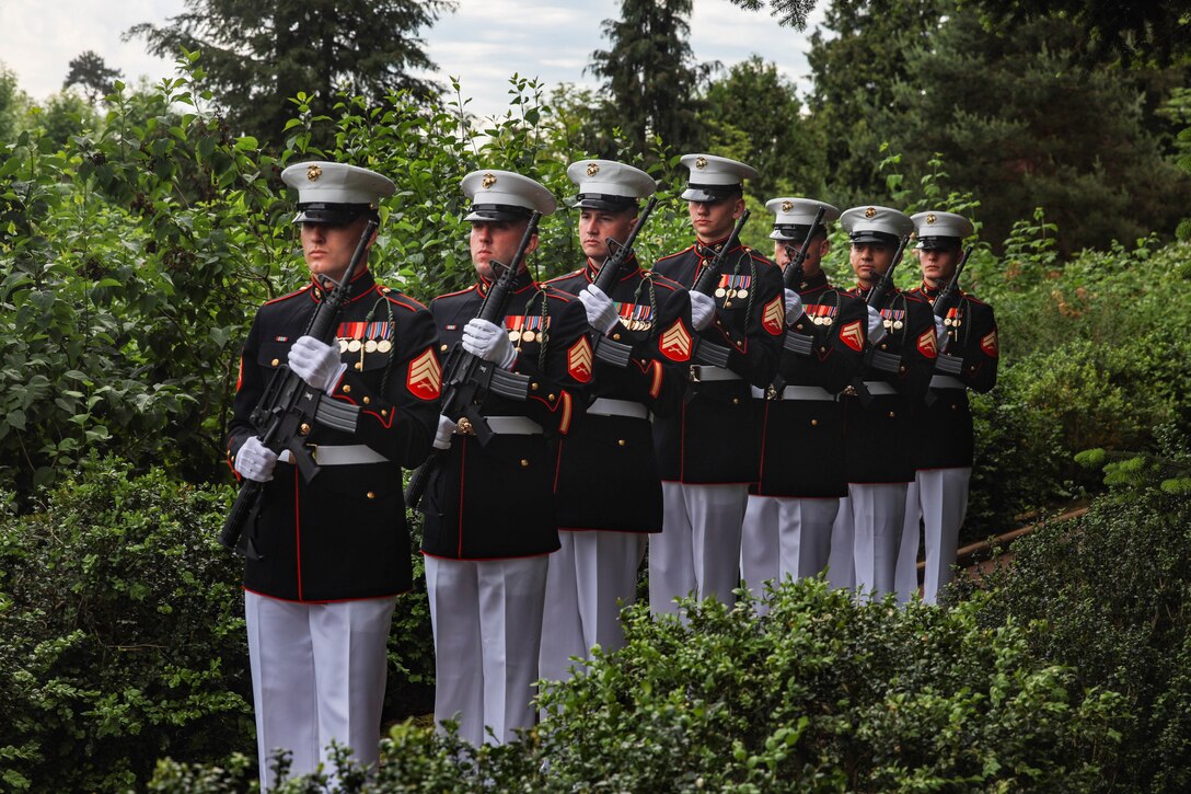 U.S. Marines with the 6th Marine Regiment, 2d Marine Division's firing detail stand in formation during a ceremony at the Aisne-Marne American Cemetery, Belleau, France, May 26, 2024. The memorial ceremony was held in commemoration of the 106th anniversary of the battle of Belleau Wood, conducted to honor the legacy of service members who gave their lives in defense of the United States and European allies. (U.S. Marine Corps photo by Sgt. Alexa M. Hernandez)
