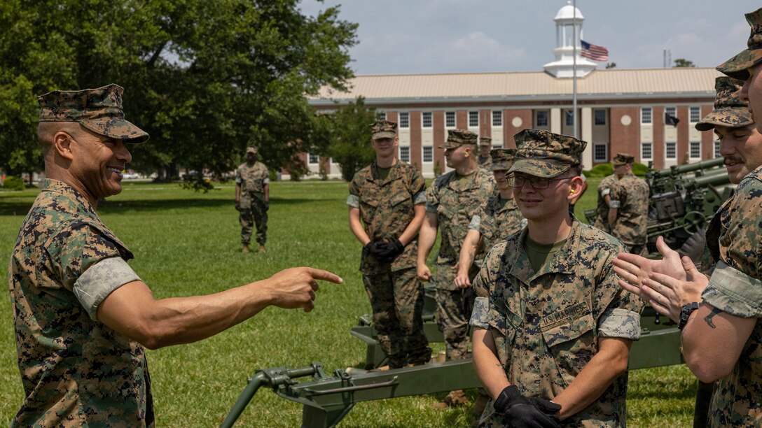 U.S. Marine Corps Maj. Gen. Calvert Worth Jr., commanding general of 2d Marine Division speaks with Marines from 10th Marine Regiment, 2d Marine Division before the 21-Gun Salute on Camp Lejeune, North Carolina, May 27, 2024. The 21-Minute Gun Salute, held in honor of Memorial Day in accordance with Naval Regulations, is a brief ceremony during which guns are discharged 21 times at one-minute intervals. (U.S. Marine Corps photo by Cpl. Noelia Vazquez)