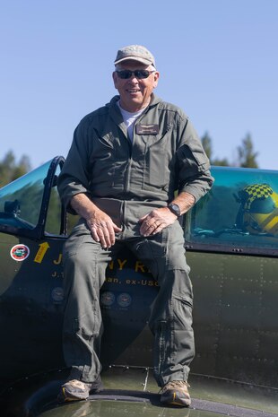 Johnathan “Johnny Reb” Freckman poses for a photograph atop of a Nanchang CJ-6 aircraft during an air show at Nevada County Airport in Grass Valley, Calif., May 19, 2024. The air show included military and civilian aircraft flyovers, food and drink vendors and a showing from all branches to support an action packed day, celebrating the armed forces. (U.S. Marine Corps photo by Sgt. Ryan Harvey)