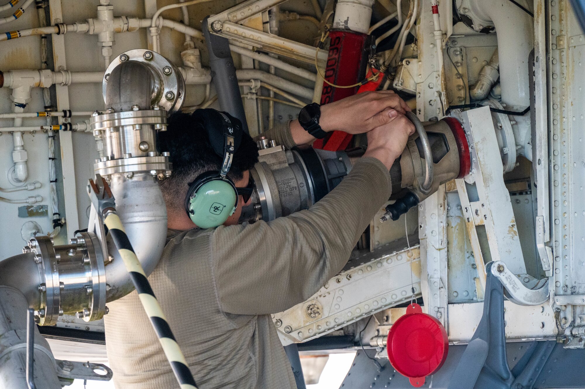 An Airman disconnects a pantograph