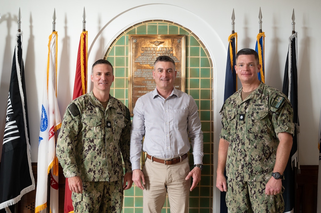During a visit to the Center for Information Warfare Training (CIWT), Victor B. Minella, Deputy Under Secretary of the Navy for Intelligence and Security (center) poses for a photo with Cmdr. Christopher Dumas, executive officer, CIWT (right) and Cmdr. Pete Manzoli, commanding officer, Information Warfare Training Command Corry Station (left) at CIWT headquarters, May 15, 2024.
