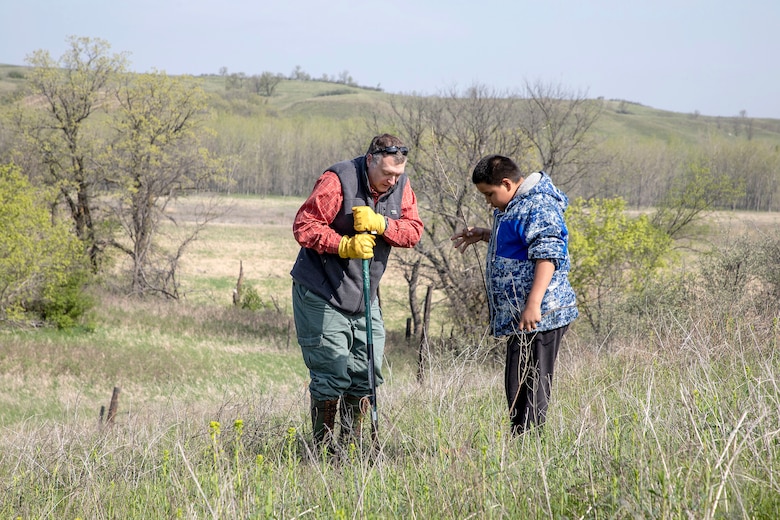 A photo from a vegetation planting partnership project.