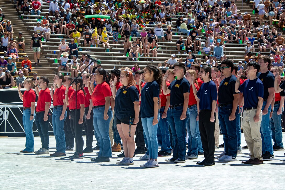 Poolees from Recruiting Station Denver swear in as a part of a Memorial Day ceremony during the BOLDERBoulder 10-kilometer race weekend, at Boulder Colorado, May 27, 2024. Marine Corps Recruit Depot San Diego and Western Recruiting Region sent Marines to represent the command during the 2024 BOLDERBoulder 10k race to engage with the local community and showcase the spirit of the organization. (U.S. Marine Corps photo by Master Sergeant Ezekiel R. Kitandwe)