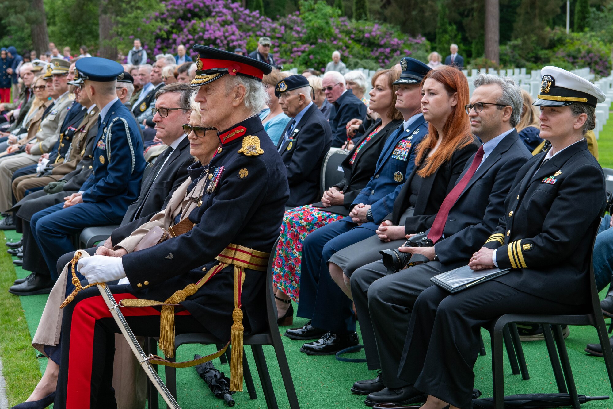 Distinguished guests listen during a Memorial Day ceremony