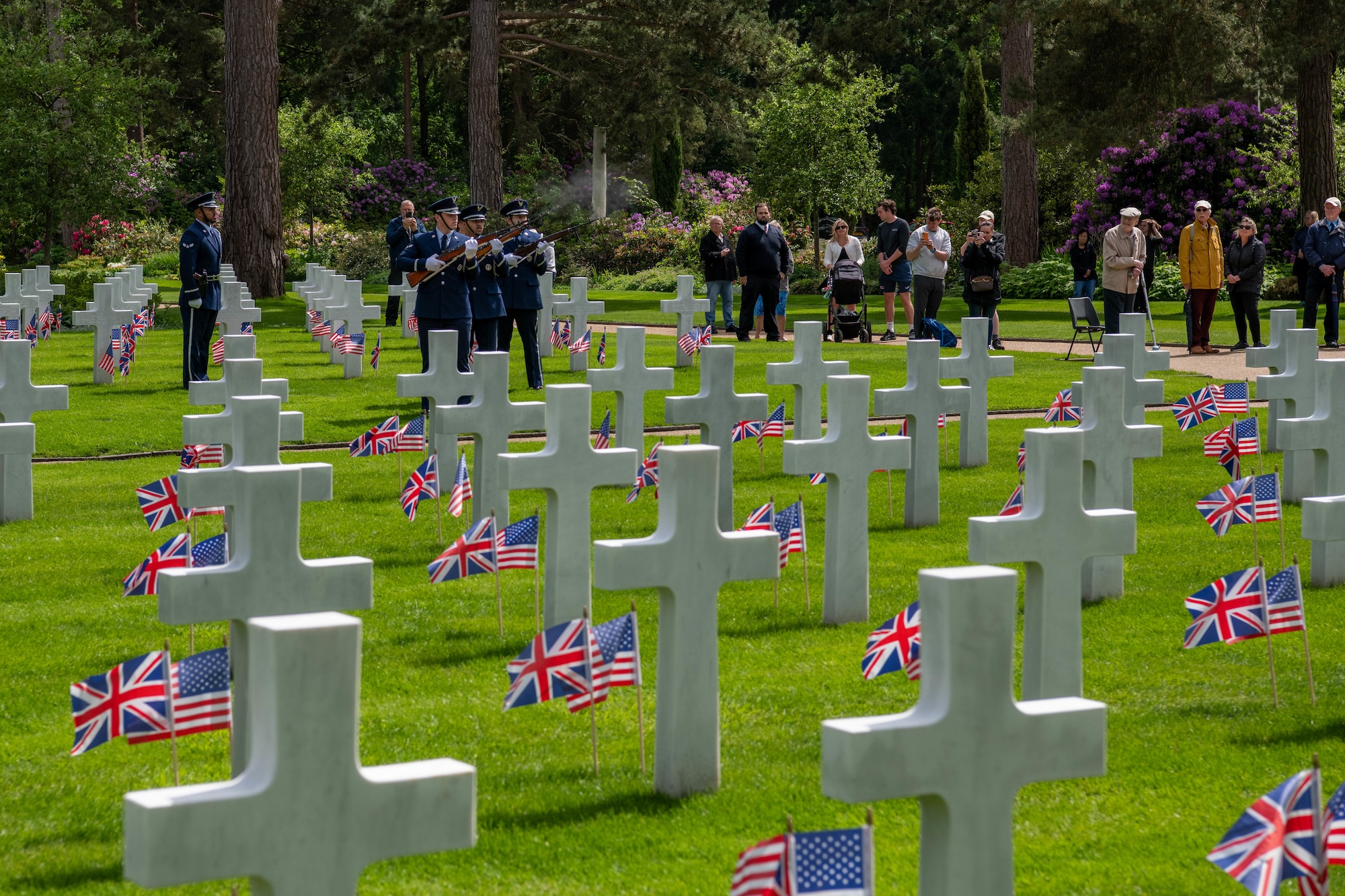 Airmen fire a three-volley-salute during a Memorial Day ceremony