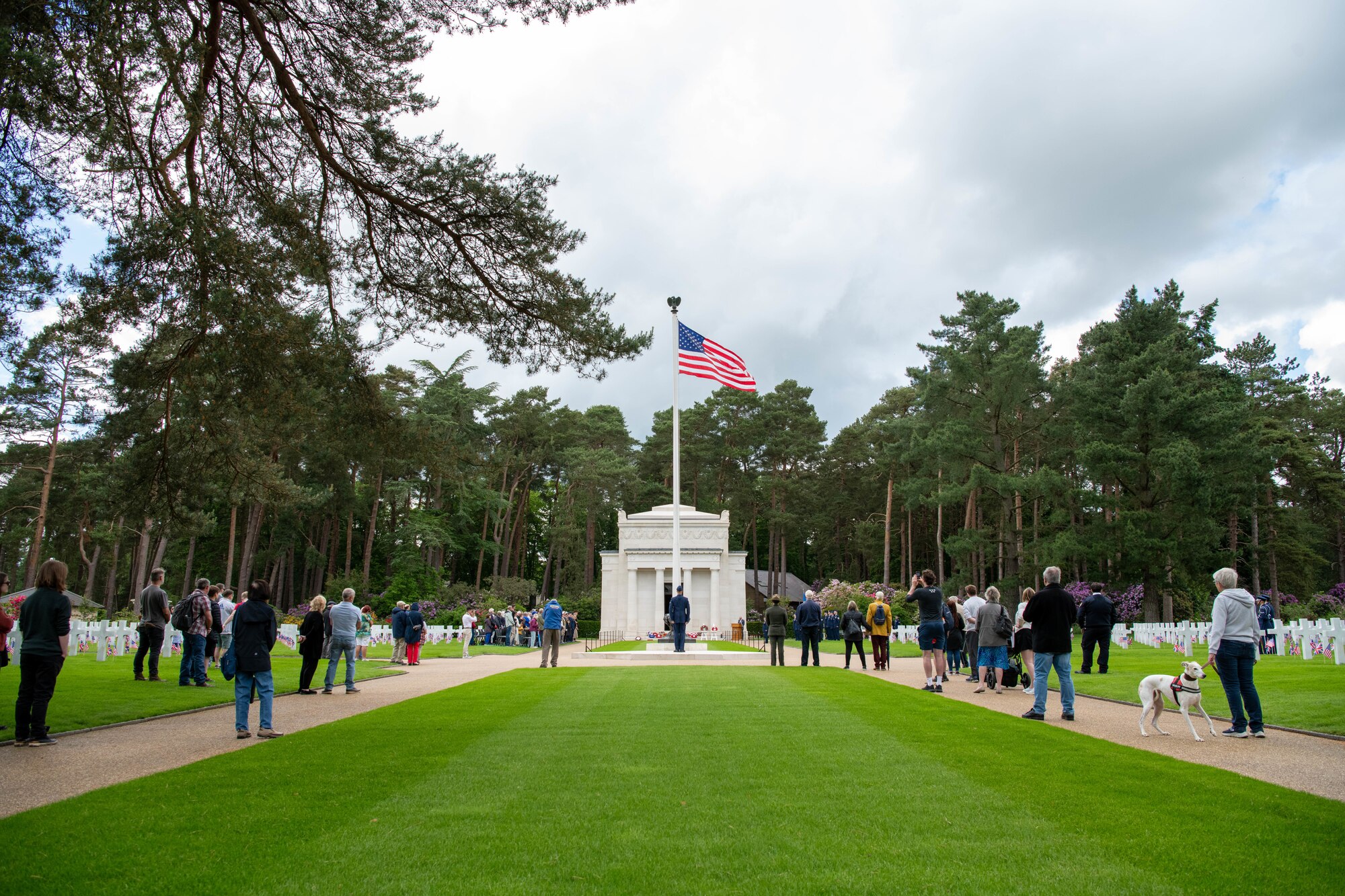 Attendees stand during a Memorial Day ceremony