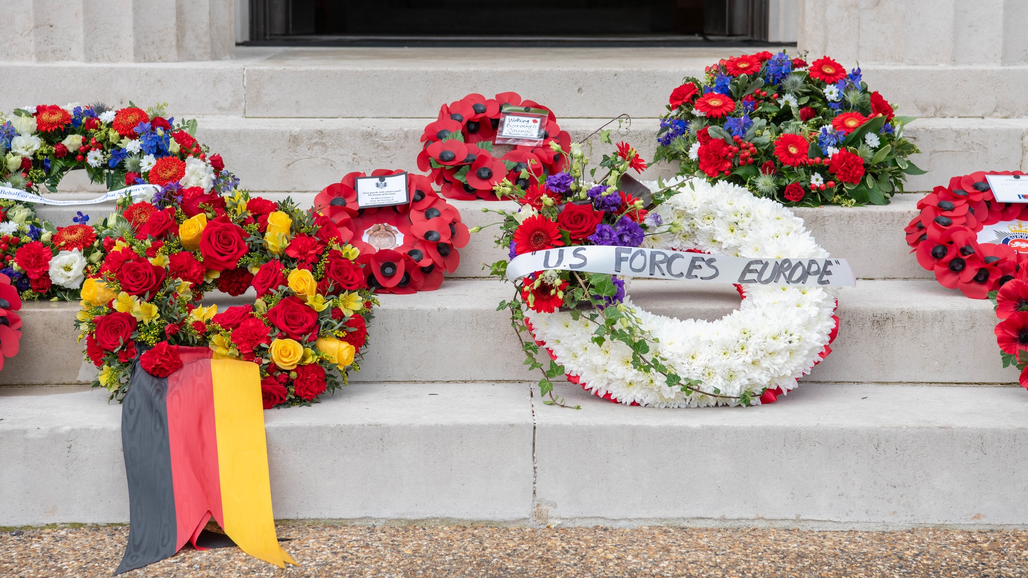 Memorial wreaths are laid on the steps of the chape