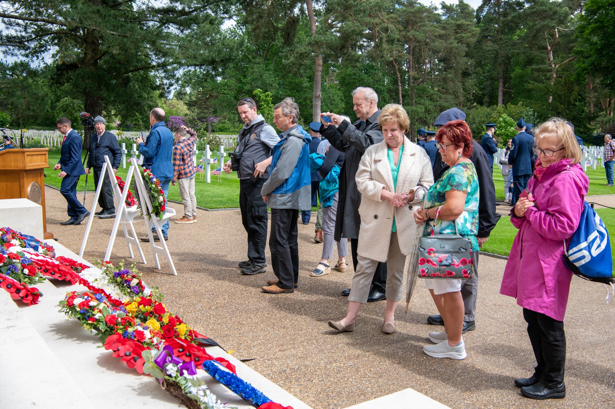 Attendees view memorial wreaths