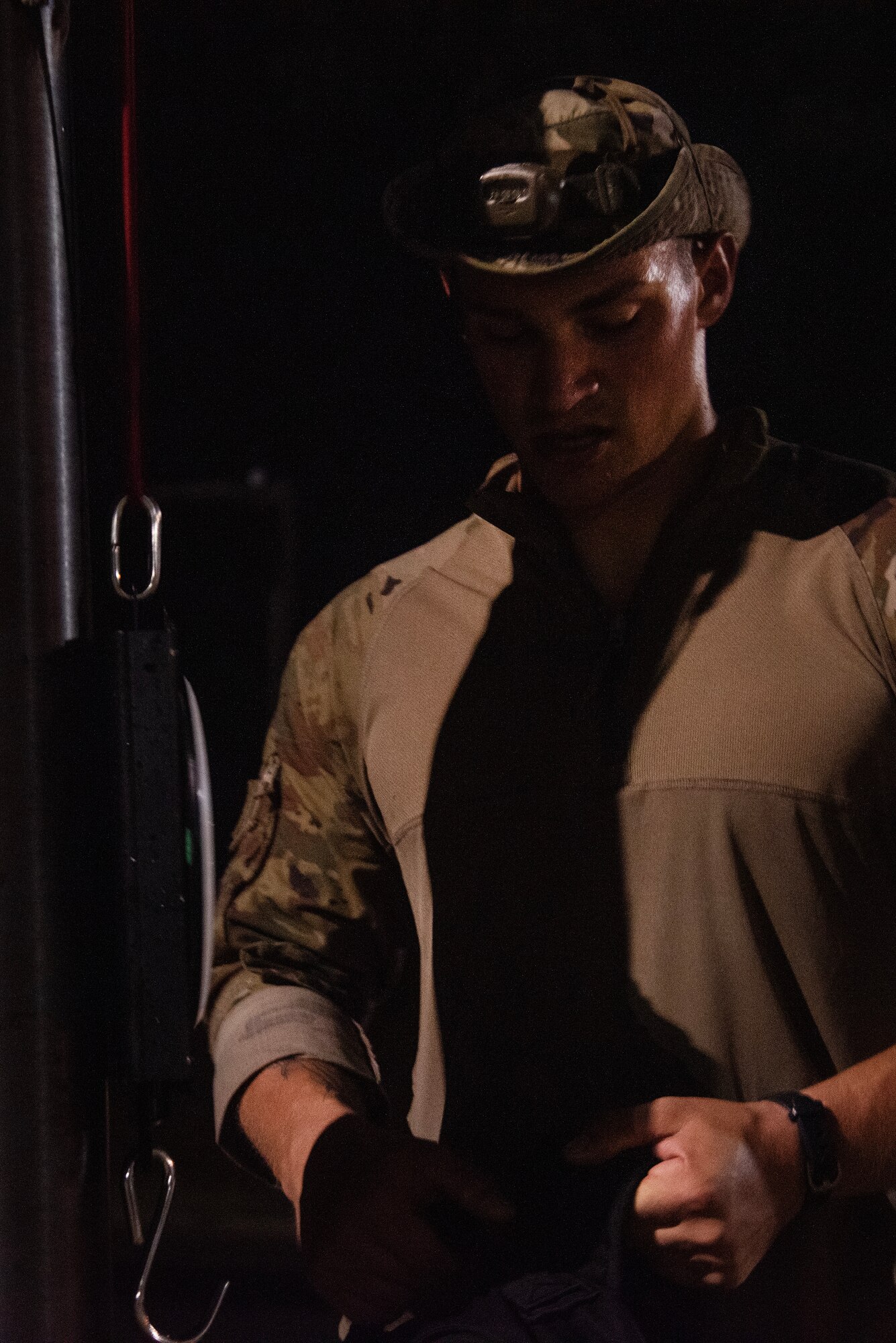 SrA Jeremy Kalminski, 4th CES, weighs his ruck sack after completing a Norwegian Foot March.