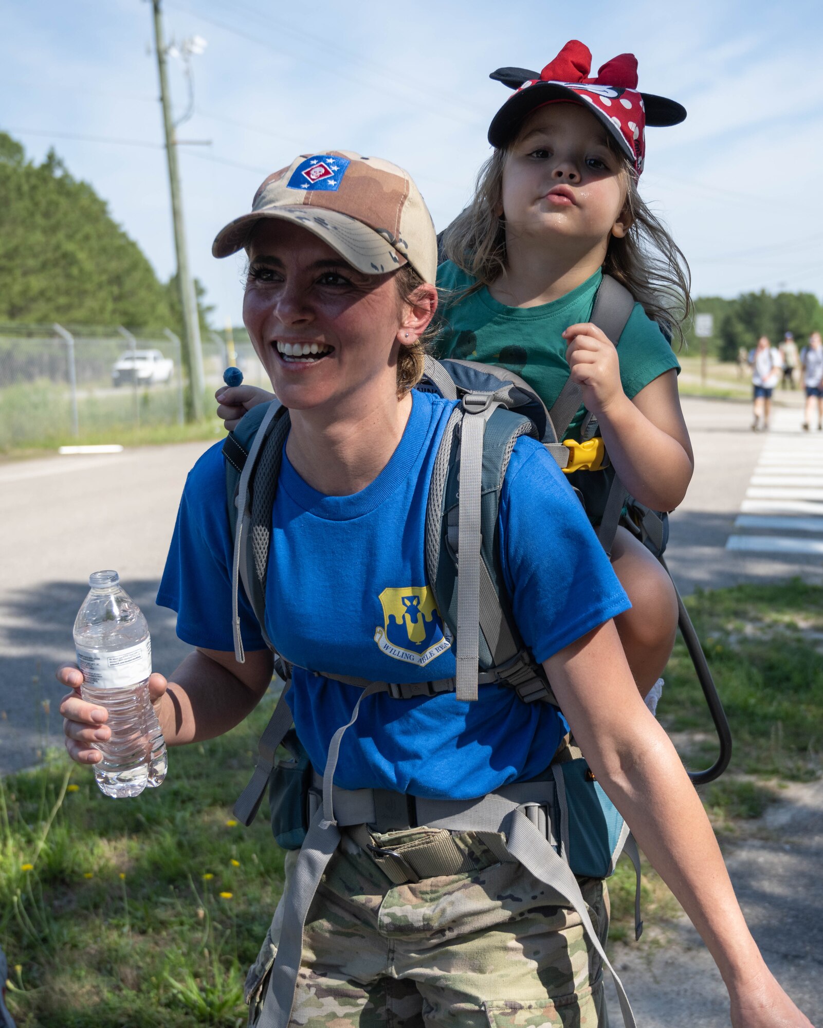 Rucksack march participants smile