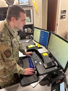 A 30th Security Forces Squadron client systems administrator, showcases troubleshooting skills he is learning in the Supra Coding Program at Vandenberg Space Force Base.