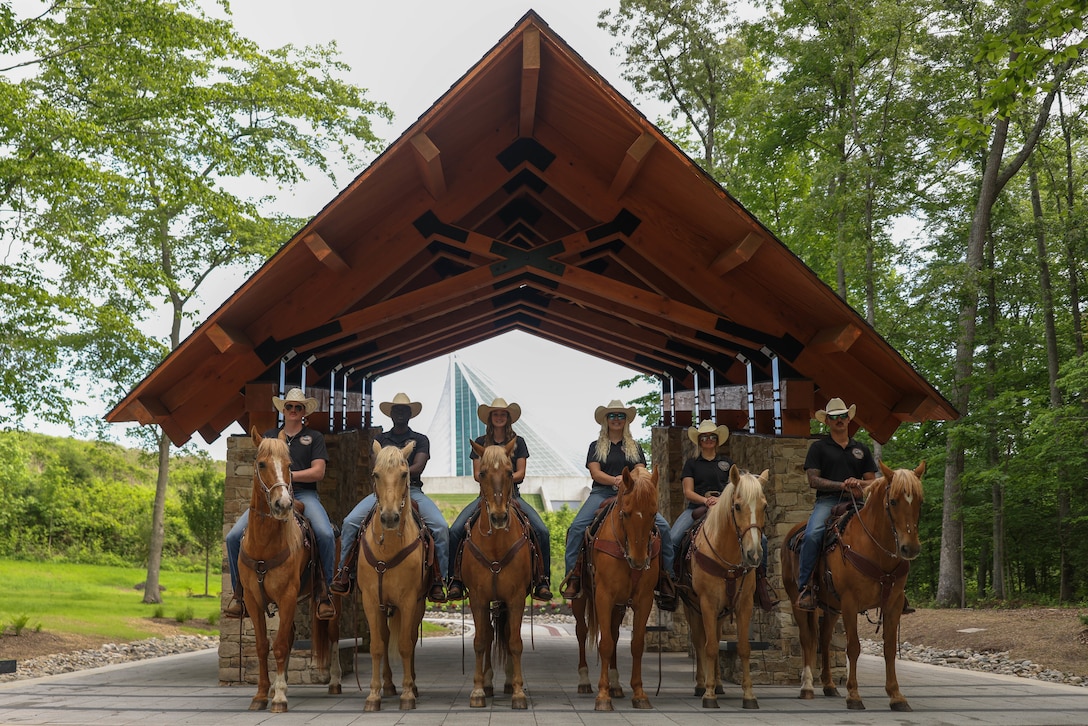 U.S. Marine Corps Mounted Color Guard pose for a photo at the National Museum of the Marine Corps, Triangle, Virginia, May 24, 2024. The Mounted Color Guard is based out of Marine Corps Logistics Base Barstow, California, and is the only mounted color guard in the Marine Corps. They travel nationwide to perform in parades, ceremonies, and rodeos. (U.S. Marine Corps photo by Lance Cpl. David Brandes)