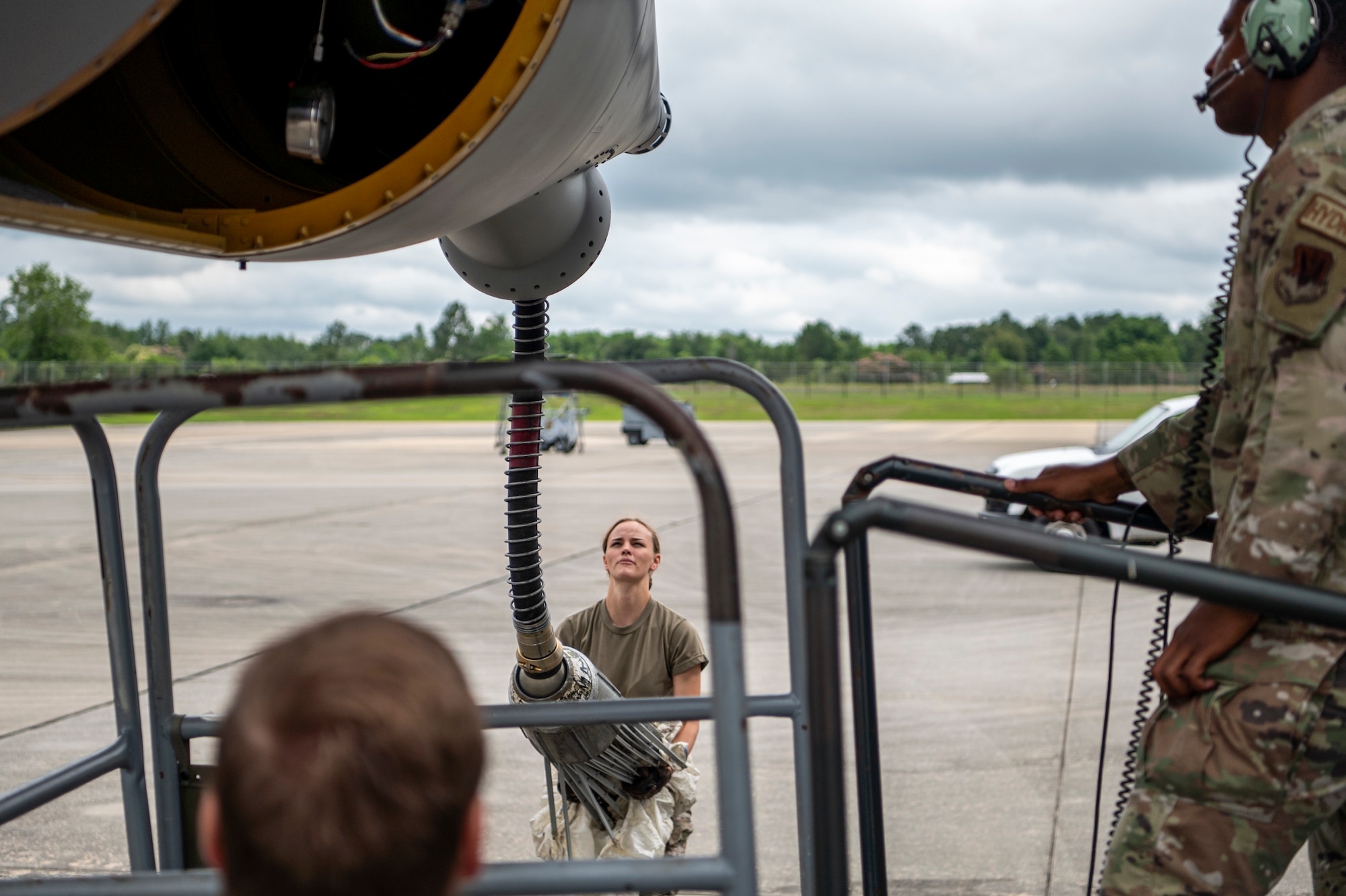 U.S. Air Force Airman 1st Class Anjali Sabaratnam, 71st Rescue Generation Squadron hydraulics systems specialist, holds an in-flight refueling chute on an HC-130J Combat King II aircraft at Moody Air Force Base, Georgia, May 20, 2024. A team of engineers from Mercer Engineering Research Center learned from Moody subject matter experts and technicians about the challenges of the HC-130J Combat King II aircraft during their visit. (U.S. Air Force photo by Airman 1st Class Leonid Soubbotine)