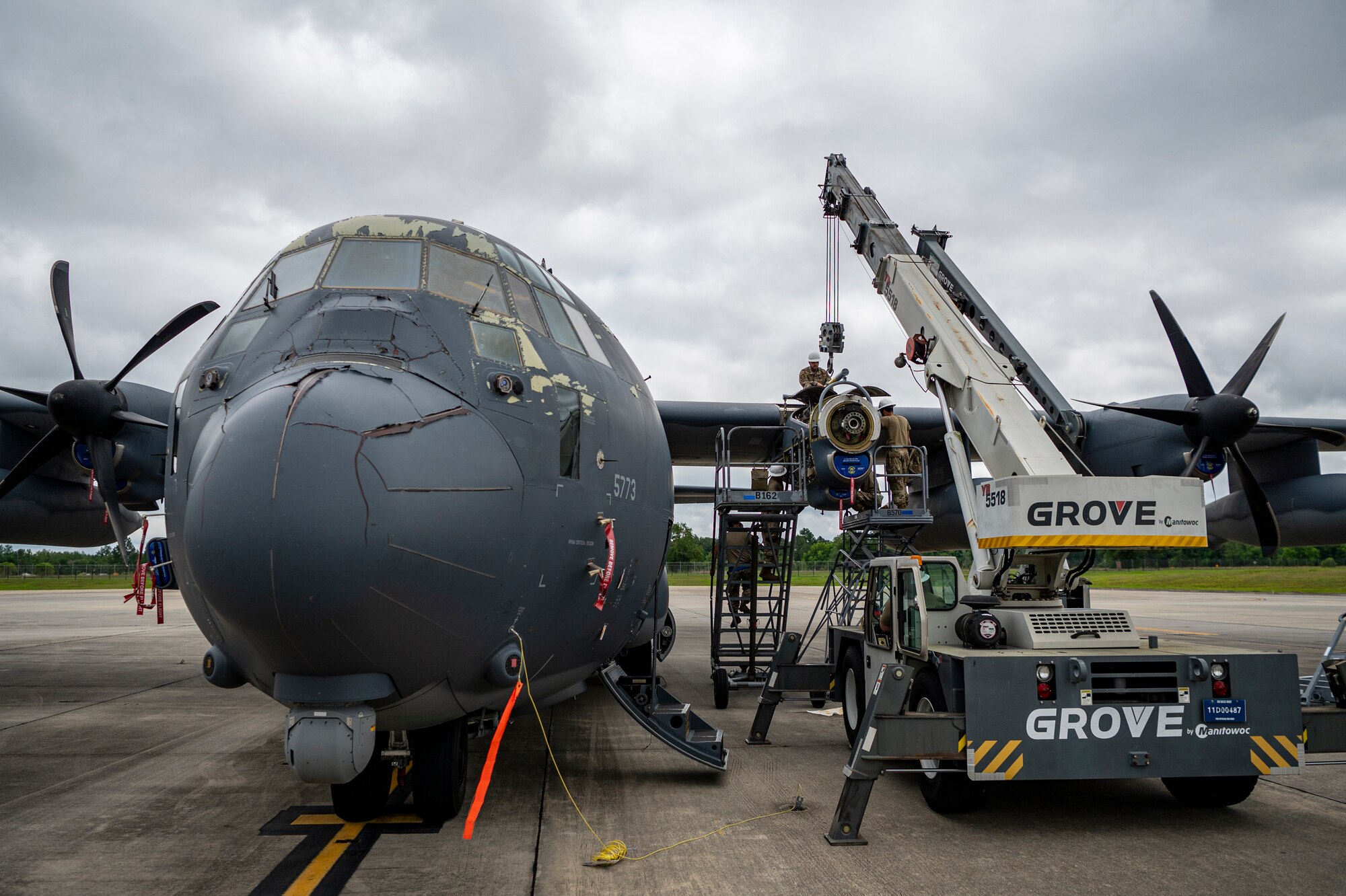 U.S. Air Force Airmen assigned to the 71st Rescue Generation Squadron work on a HC-130J Combat King II engine at Moody Air Force Base, Georgia, May 20, 2024. A team of engineers from Mercer Engineering Research Center were able to observe and learn about the process of an engine replacement. (U.S. Air Force photo by Airman 1st Class Leonid Soubbotine)